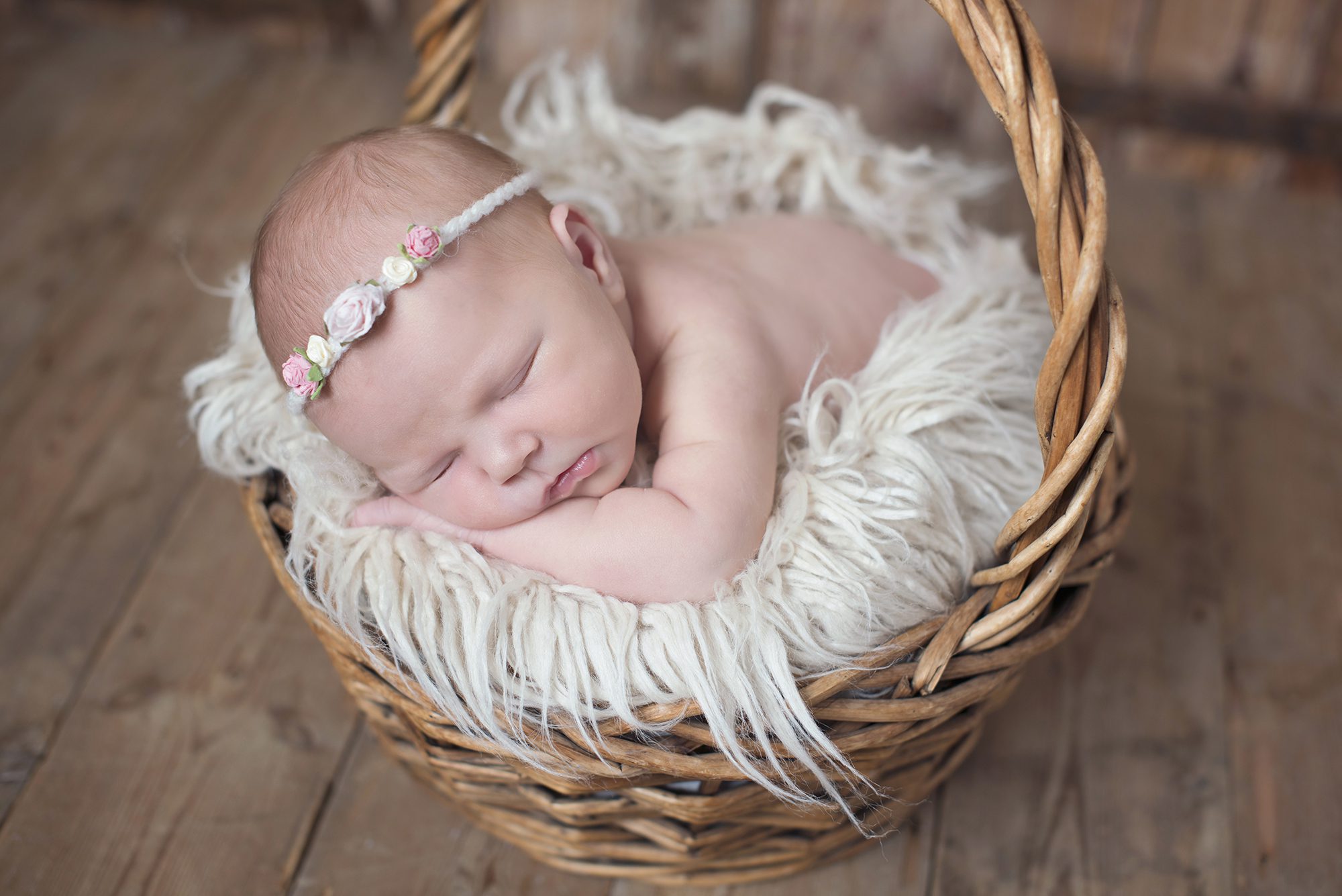 baby sleeping in basket by photographer Maidenhead