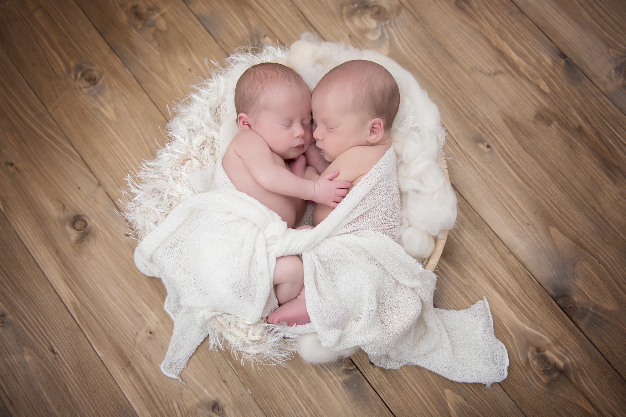 baby twin sisters wrapped in cream in newborn photography session, Reading