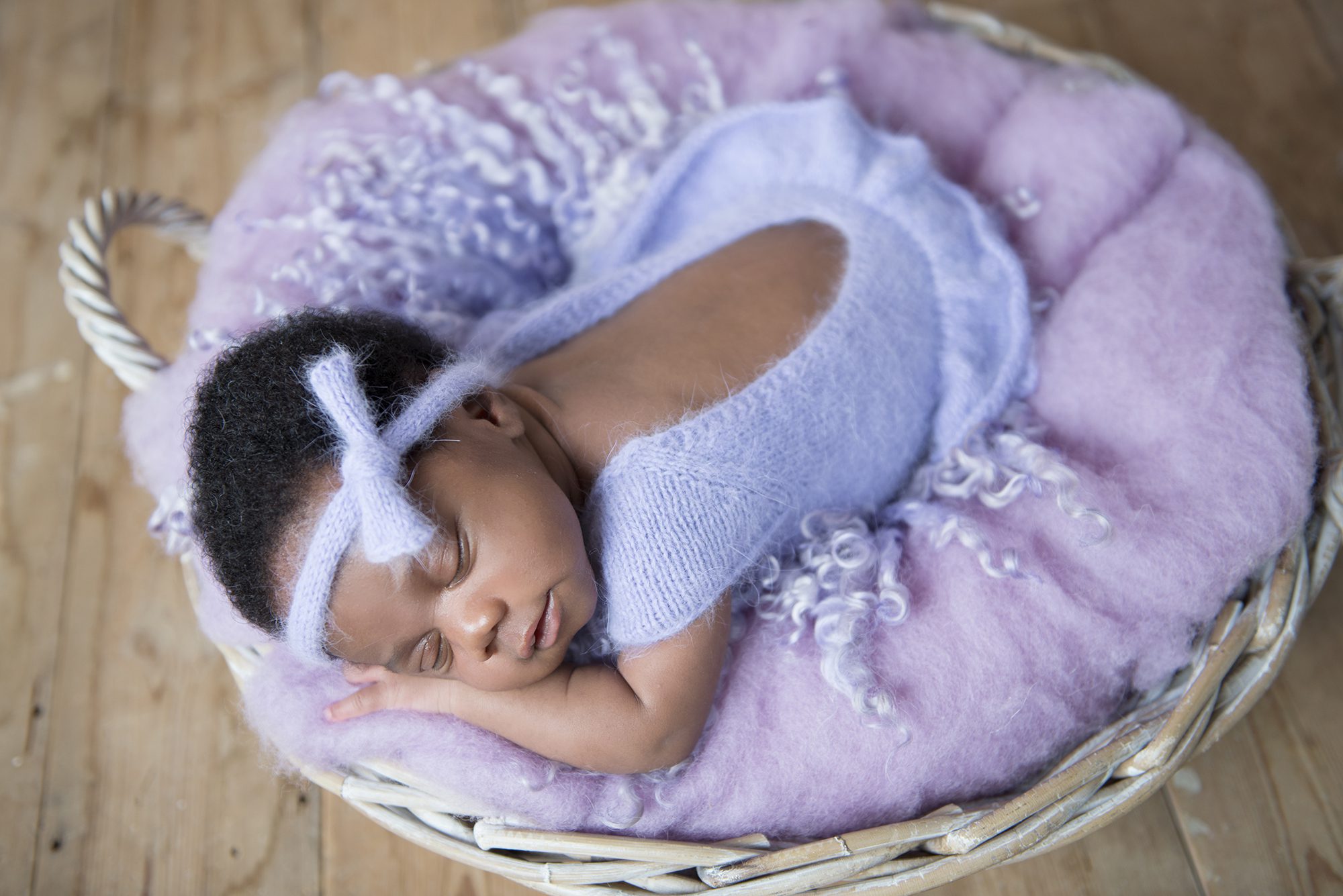 baby in lilac photographed by newborn photograph Woodley, Berkshire