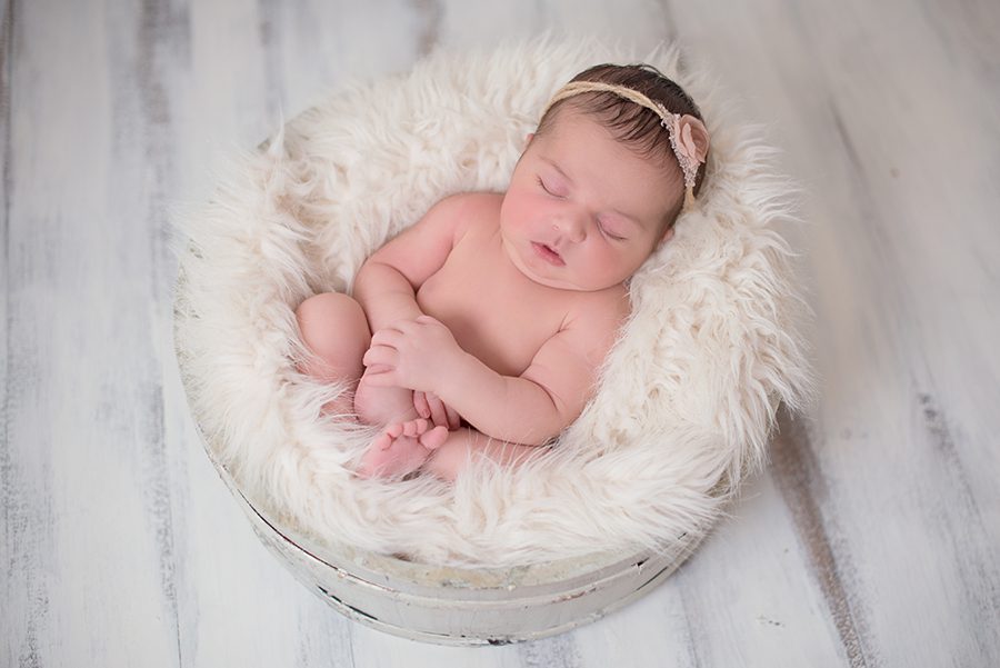 newborn baby sleeping in white tub, photographer Berkshire