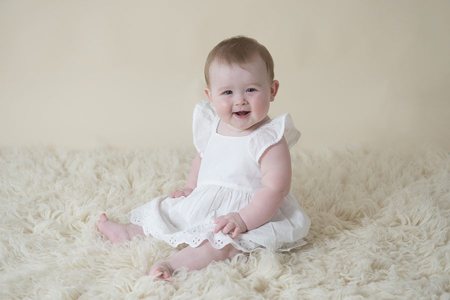 baby sitting up smiling in photoshoot, Twyford, Reading, Berkshire